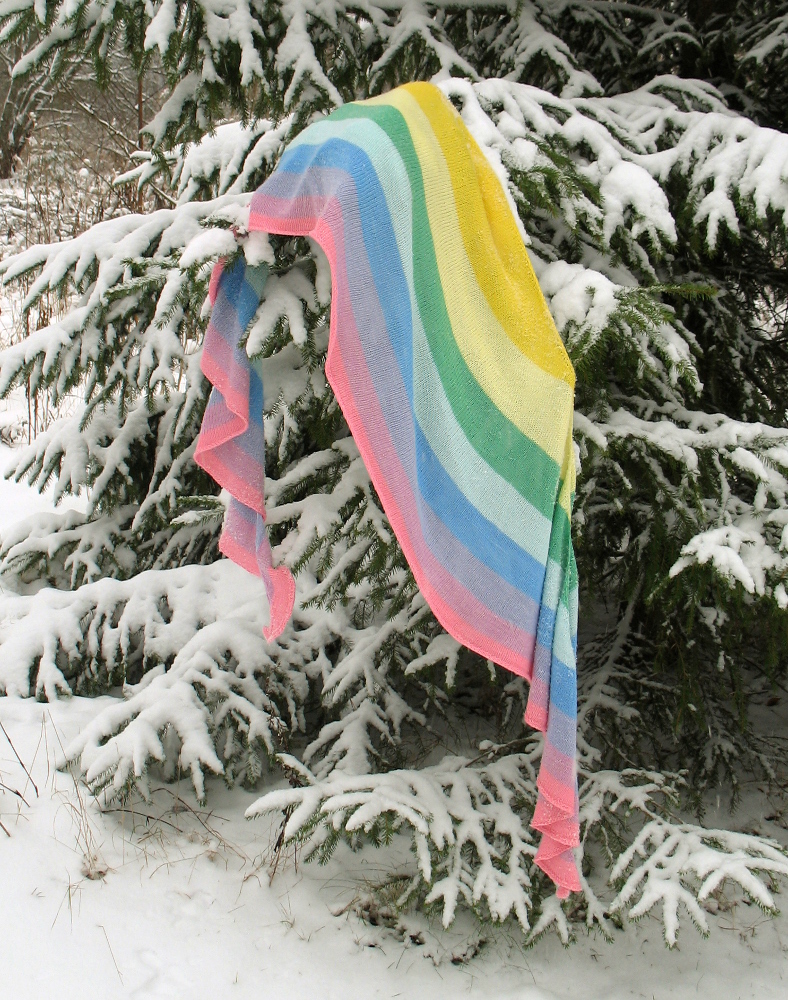 Sateenkaari shawl on a branch of tree