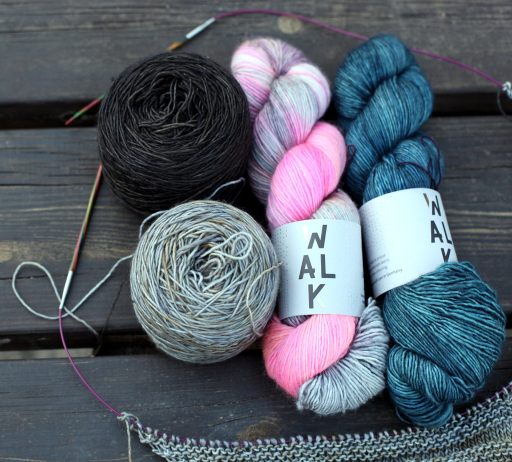 Two balls and two hanks of yarn
